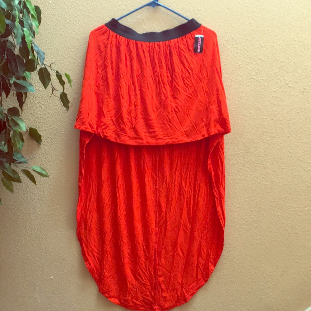 Orange high-low skirt.